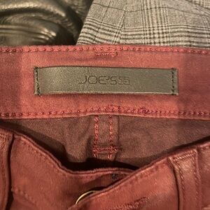 Shiny burgundy skinny jeans